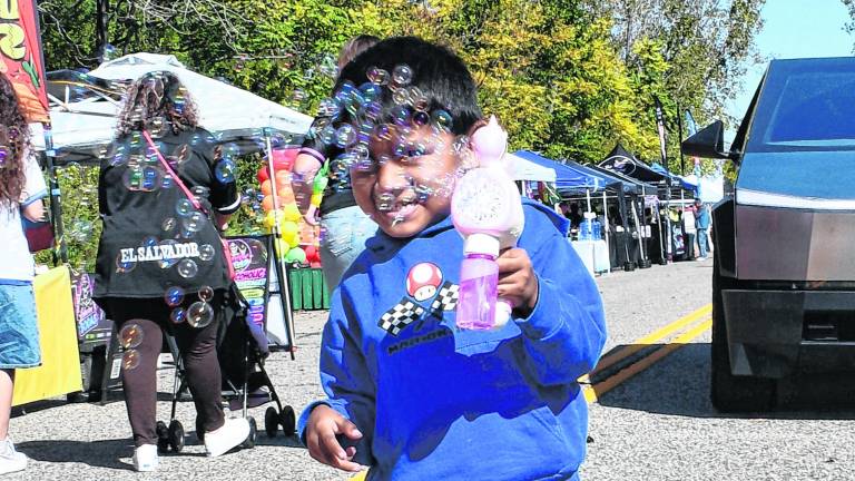 <b>Xander Duahuizo of New York blows bubbles.</b>