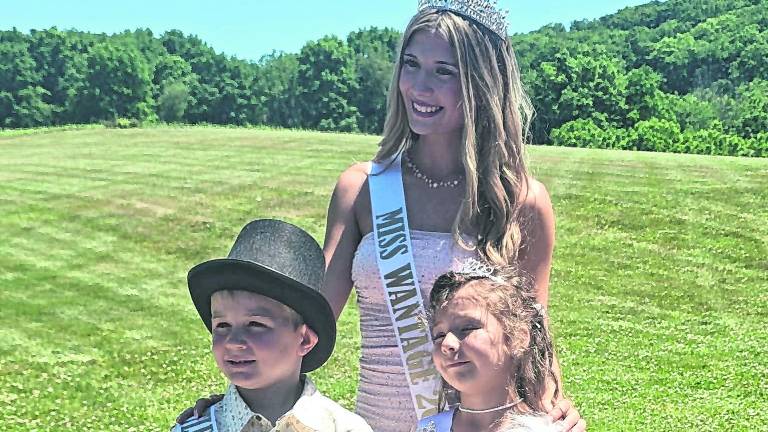 <b>Miss Wantage 2026 Julianne Wynn, back, is shown with Little Mister Wantage 2026 Cooper Thomas Gebauer and Little Miss Wantage 2026 Mayzeli Rose Marie Leavitt.</b>
