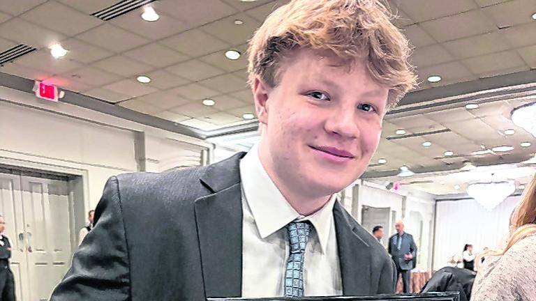 <b>Vernon linebacker Gavin Wilczewski is shown with his award.</b>