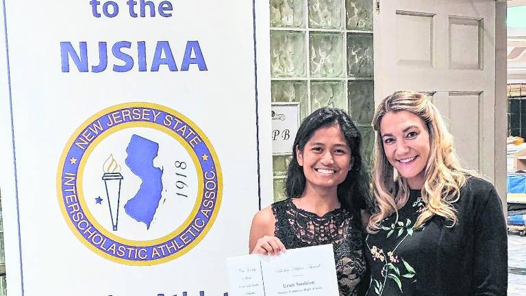 <b>Senior Uriah Sacdalan was Vernon’s representative at the annual NJSIAA Scholar Athlete Luncheon held at the Pines Manor in Edison this past Sunday (May 17). Uriah is currently second in the class and participates in the Girls’ Wrestling and Golf Teams. Pictured with Uriah is head wrestling coach Ashley Gocklin.</b>