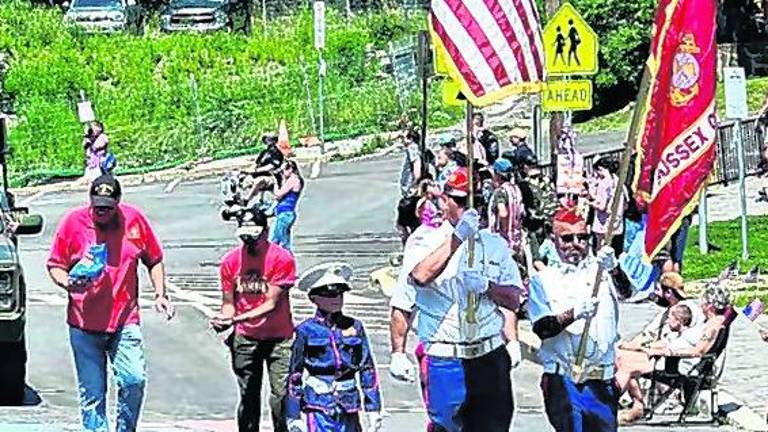 <b>The color guard marches with the flag.</b>