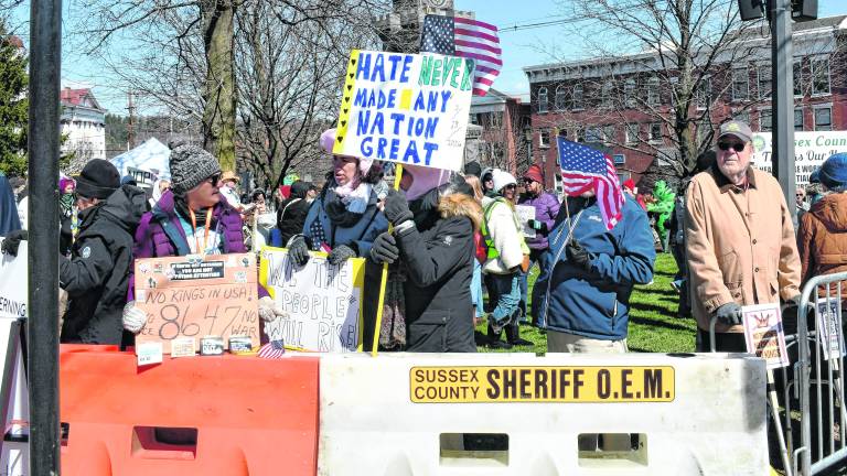 About 500-600 people turned out to protest the policies of President Donald Trump at a No Kings Rally at the Newton Green on Saturday.