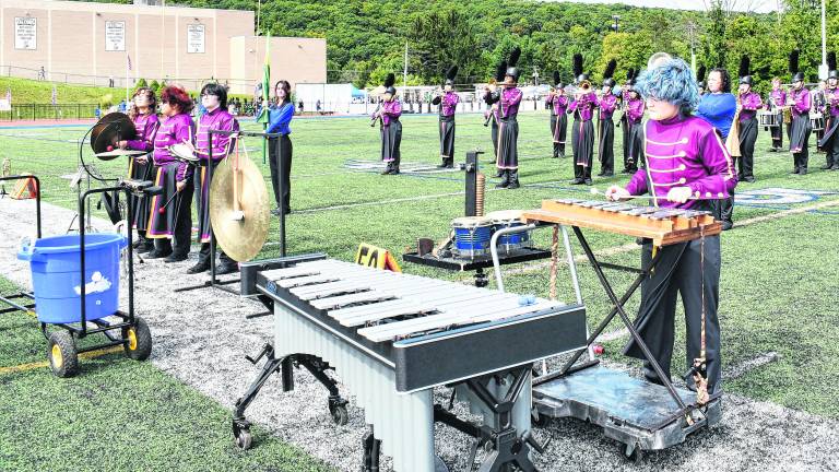 The Newton High School Marching Band performs.