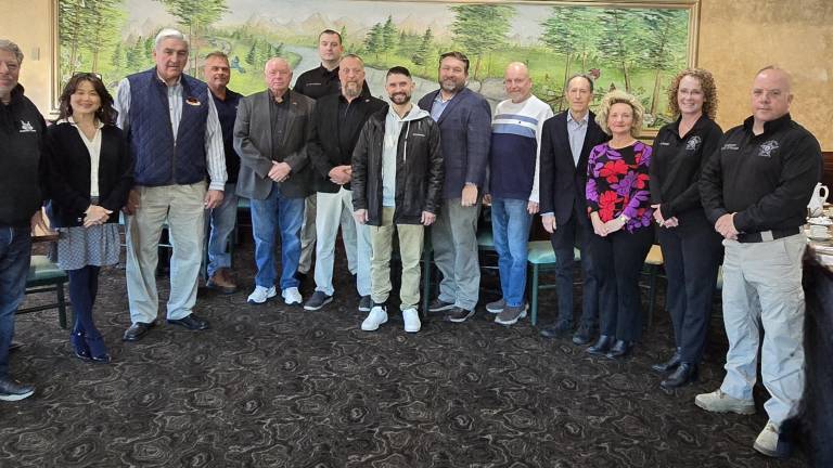 <b>From left to right: John Hatzelis, Board Treasurer Emily Olinger, Board President Bob Hoover, Joe Flanagan, Rich Ulrich, Investigator Christian Peterson, Dave Silverthorne, Brian McCurdy, Craig Thompson, Herb Yardley, Rich Kelsky, Marie Galate, Board Secretary Hilary Manser and Sussex County Sheriff Michael Strada</b>